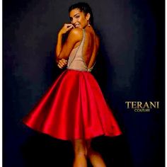 Terani Couture Stunning Homecoming, Evening Short Dress. A Fully Ornate. Crystal Beaded Bodice. This Sleeveless Dress Features A Deep Plunge Curved V-Neckline With A Center And Side Illusion Sheer Inserts. The Box Pleated Skirt Flares At Above The Knee Length Hem As The Back Is Secured With A Center Zipper Closure Red A-line Evening Dress For Party, Red Satin Embellished Evening Dress, Red Embellished Satin Evening Dress, Red Embellished Satin Dress, Red Embellished Evening Dress, Glamorous Red A-line Dress, Box Pleated Skirt, Box Pleat Skirt, Terani Couture