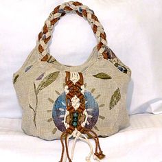 Macram Vintage Style Shoulder Bag - Retro Bohemian Bag A Bit Of Beautiful Macram And Beads Added To This Bag. Braided Handle/Straps, Very Earthy Colors. Beautiful Bag For The Fall Season. Brand New In Package. Lots Of Pockets Including Front & Back. Description Unique Design: Vintage Floral Embroidery And Retro Western Style Make This Tote Bag Stand Out From The Crowd. Spacious: Large Enough To Carry All Your Essentials, This Hobo Bag Is Perfect For Everyday Use. Versatile: Can Be Used As A Handbag Or A Purse, Making It A Great Addition To Your Collection. High-Quality Material: Made With Durable Materials To Ensure Long-Lasting Use. Bohemian Chic: Perfect For Addi Beige Bohemian Hobo Bag, Bohemian Beige Hobo Bag, Bohemian Braided Beige Bag, Bohemian Satchel Hobo Bag With Braided Handles, Bohemian Hobo Bag With Braided Handles For Daily Use, Bohemian Bags With Braided Handles For Everyday Use, Bohemian Shoulder Bag With Braided Handles For Everyday, Bohemian Beige Shoulder Bag With Handles, Everyday Bohemian Macrame Shoulder Bag