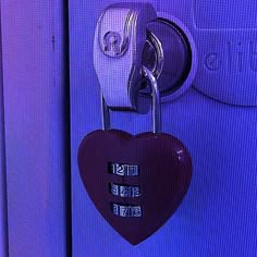 a heart shaped padlock attached to a door