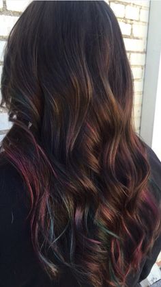 Rainbow hair Subtle Rainbow Hair Brunette, Dark Brown Hair With Lavender Peekaboos, Pop Of Color Hair Hidden, Oil Slick Balayage, Dark Hair With Colored Ends, Subtle Oil Slick Hair, Rainbow Peekaboo Hair Dark Brown, Rainbow Tips Hair, Subtle Colorful Hair