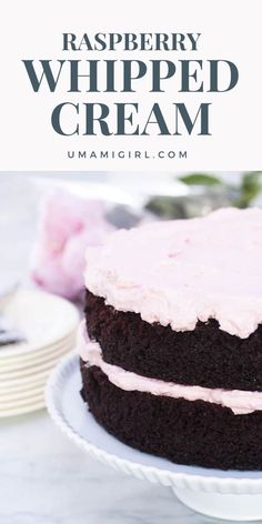 a close up of a cake on a plate with the words raspberry whipped cream