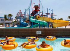 an image of people on inflatable rafts at the water park