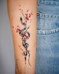 a woman's arm with a tattoo design on the left side of her body