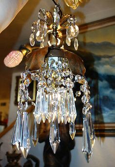 a chandelier hanging from the ceiling in a room