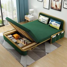 a bed with an open storage compartment in the middle of it and pictures on the wall