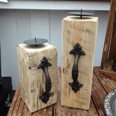 two wooden blocks with metal handles on them