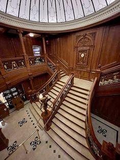 an ornate wooden staircase in a building