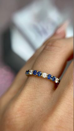 DETAILS: * Handmade item * Gemstone: Sapphire, Natural Diamond * Gem color: Blue * Band color: Yellow Gold (may vary on gold selection) * Condition: Never been Used; Made to order, Recycled Metal, Conflict-free 100% DESCRIPTION: 💎 Welcome to the Our Shop, Congratulations🍾 on discovering us. 💎 You'll be amazed at the beauty and delicate craftsmanship of this ring. This custom 18-karat gold stacking eternity ring features alternating 2 round blue sapphire sit side-by-side with one white diamond Sapphire Colors Stones, Dazzling Yellow Gold Sapphire Ring, Elegant 14k Gold Multi-stone Eternity Band, Round Multi-stone Diamond Sapphire Ring, Yellow Gold Diamond Ring With Tanzanite In Prong Setting, Gemstone Eternity Band As Gift, Multi-stone Sapphire Ring With Diamonds, Multi-stone Sapphire Diamond Ring With Round Cut, Yellow Gold Cubic Zirconia Gemstones With Accent Stones