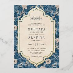 an ornate blue and gold wedding card with flowers on the front, in arabic script