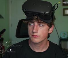 a young man wearing a virtual reality headset