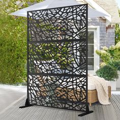 an outdoor gazebo made out of metal and wood with plants growing inside the top