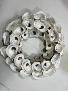 a wreath made out of oysters on a table