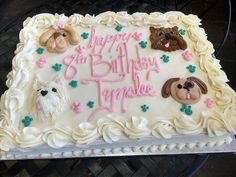 there is a birthday cake with dogs on it