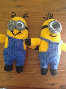 two knitted minion dolls standing next to each other