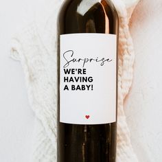 a bottle of wine sitting on top of a white blanket