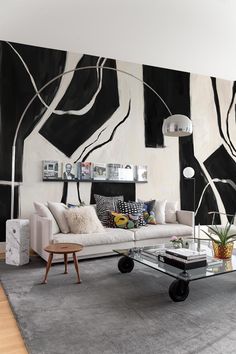 the living room is decorated in black and white