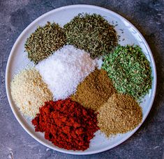 a white plate topped with different types of spices