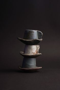 a stack of three cups sitting on top of each other