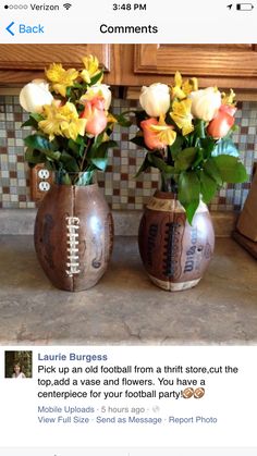 two vases with flowers in them sitting on a kitchen counter next to a tile backsplash