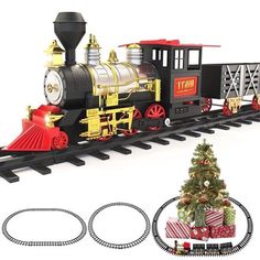 a toy train is on the tracks next to a christmas tree