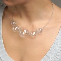 "This Clear glass ball necklace is made of glass in the lampwork technique, each bead is hand blown and unique. This bold chunky necklace is lightweight, stylish and elegant and will become a versatile and irreplaceable addition to your everyday outfits! 💕 You will definitely look stunning in this glass bubble necklace! Dimensions: the necklace length is adjustable, 20\"-22\" inch (51-56cm). Materials: artist lampwork glass beads, metal fittings. 🎁 This large bead necklace will also be a great Handmade Luxury Glass Beaded Necklaces, Modern Handmade Clear Necklaces, Clear Glass Beaded Necklaces, Clear Glass Round Bead Necklaces, Clear Glass Necklaces With Round Beads, Clear Glass Round Beads Necklaces, Clear Glass Necklaces For Party, Modern Glass Necklaces With Round Beads, Modern Glass Round Bead Necklaces