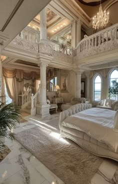 a large bedroom with white furniture and chandelier