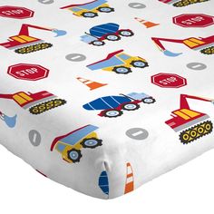 a bed sheet with construction vehicles on it