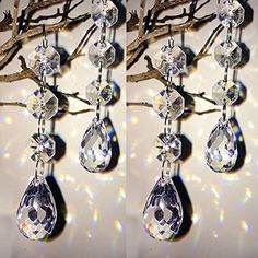 two pictures of some kind of crystal chandelier hanging from a tree with lights in the background