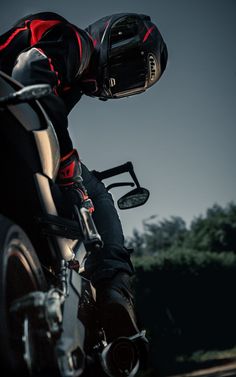 a man riding on the back of a motorcycle