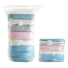 four different colors of diapers stacked on top of each other in plastic bags with buttons