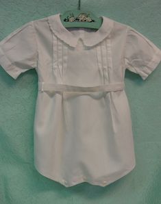 "This is a very cute little vintage baby or doll/teddy romper. There is no label but it is 18\" in length and 10\" across shoulders in back. It is bright white cotton with wonderful sewing details. There is embroidery on the collar and front, tucks and fancy stitching and a belt that fastens in back with two buttons. There are also two buttons in back and at the crotch. It is in excellent clean condition with no marks or flaws. I combine shipping and am happy to provide a shipping quote to inter Sewing Details, Aesthetic Galaxy, Romper Suit, Gender Neutral Baby Clothes, Gender Neutral Baby, Baby Romper, Vintage Baby, Bright White, White Cotton