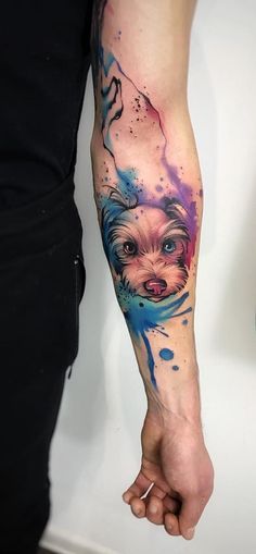 a person with a dog tattoo on their arm