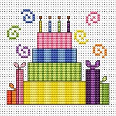 a cross stitch birthday cake with candles and numbers on the side, in bright colors