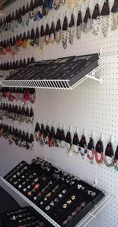 the wall is full of earrings and necklaces