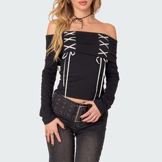 Elevate your style effortlessly with our Black Gothic Off-The-Shoulder Long Sleeve Top. The lace-up detail and folded neckline bring an edgy touch, while the bardot top style exudes sophistication. Crafted from a comfortable and stylish blend of polyester and spandex, this top is a must-have for your wardrobe. Lace-up detail Folded neckline Long sleeves Bardot top style Comfortable blend of polyester & spandex Gothic Crop Top For Spring Night Out, Gothic Crop Top For Night Out In Spring, Edgy Off-shoulder Tops For Night Out, Spring Gothic Crop Top For Night Out, Casual Off-shoulder Top For Fall Night Out, Trendy Off-shoulder Top For Night Out In Fall, Edgy Off-shoulder Party Tops, Edgy Stretch Off-shoulder Tops, Edgy Off-shoulder Top For Fall