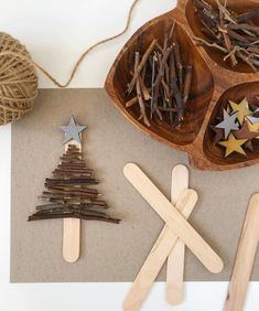 an image of popsicle christmas tree made out of wood sticks and star shaped decorations