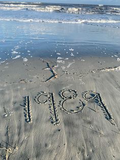 the word 2013 written in the sand at the beach