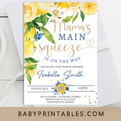 a baby shower party with yellow flowers and greenery on the front, in gold foil