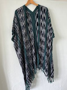 These gorgeous hand-woven, hand-dyed kimonos are lovingly made with natural fabrics and plant dyes. Transform any outfit into something eye-catching, unique and elegant. The fabric is super soft and drapes beautifully, the perfect cover up for any outfit or for the beach. Every purchase supports our partner women's collective in Guatemala. Available in a variety of colors. Bohemian Handwoven Shawl Poncho, Bohemian Ikat Print Kimono For Summer, Bohemian Woven Poncho For Fall, Bohemian Green Tunic Kimono, Fall Bohemian Woven Poncho, Bohemian Long Kimono With Ikat Print, Bohemian Handwoven Poncho One Size, Long Bohemian Kimono With Ikat Print, Bohemian Handwoven Poncho For Festival