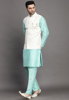 Art Silk Kurta in Sky BlueThis Readymade attire is Enhanced with Buttons and Resham Work. Crafted in Chinese Collar Neck and Full SleeveAvailable with an Art Silk Pant in Sky Blue and an Art Silk Nehru Jacket in Off WhiteDo note: Brooch and Footwear shown in the image is for presentation purposes only. Half to one inch may vary in measurement. (Slight variation in actual color vs. image is possible) We sell all kinds of menswear. Mens Kurta | Mens Kurta Pajama | Mens Sherwani | Mens Sherwani Set Diwali Kurta For Men, Blue Nehru Jacket With Stand Collar For Winter, Blue Winter Nehru Jacket With Stand Collar, Blue Long Sleeve Nehru Jacket For Festivals, Blue Long Sleeve Bandhgala For Spring, Blue Embroidered Cotton Nehru Jacket, Embroidered Cotton Bandhgala In Blue, Embroidered Blue Cotton Bandhgala, Transitional Embroidered Blue Nehru Jacket