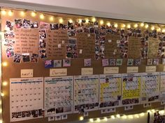 a bulletin board with pictures and lights on the wall in front of it that is decorated with magnets