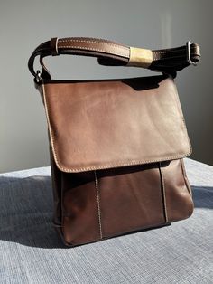 men's shoulder bag in brown leather, handcrafted. Modern Brown Leather Backpack With Leather Lining, Brown Leather Shoulder Satchel, Brown Leather Lined Hobo Shoulder Bag, Leather Flap Bag With Leather Handles For Travel, Brown Leather Hobo Shoulder Bag, Brown Leather Saddle Bag With Leather Handles, Brown Leather Handle Satchel For Everyday, Brown Leather Saddle Shoulder Bag, Brown Leather Shoulder Bag With Leather Lining