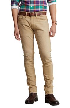 A hint of stretch means a flexible fit in versatile, modern-cut jeans set apart in a sandy khaki wash. 14" leg opening; 10" front rise; 14 1/2" back rise 98% cotton, 2% elastane Dry clean or machine wash, tumble dry Imported Blue Jeans Mens, Ralph Lauren Slim Fit, Stretch Denim Fabric, Set Apart, Slim Denim, Polo Jeans, White Polo, Ralph Lauren Jeans, Slim Straight Jeans