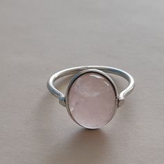 Handmade Rose quartz bohemian ring , you can wear this ring as a party wear ring .. Title - Rose Quartz stone ring Stone color - Pink Stone shape - oval Material - Sterling silver 925 Note - We use natural gemstones, so color shade may be little bit different .. we are giving you best quality rings on best price .. contact us for more quantity Silver Rose Quartz Crystal Ring, Pink Stone Ring, Ring Rose Quartz, Quality Rings, Pink Stone Rings, Green Stone Rings, Bohemian Ring, Handmade Rose, Tiny Rings