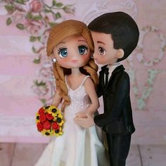 a wedding cake topper with a bride and groom