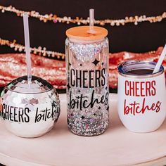 three personalized tumblers sitting on top of a white tray next to each other