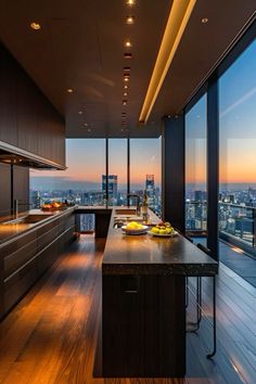 a large kitchen with an island in the middle of it and lots of windows on both sides