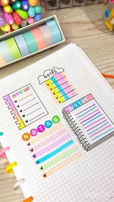 an open notebook with colorful stickers on it next to some markers and pencils