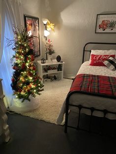 a bedroom with a christmas tree in the corner