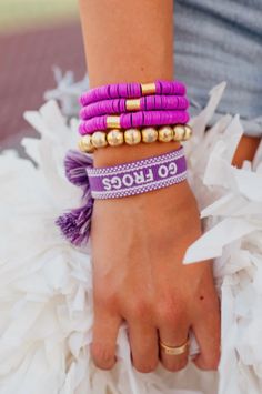 We love this embroidered fun tassel tie bracelet for gameday! White Dress Formal, Feather Tops, Summer Sundress, Beach Bridal, Top Graphic Tees, Top Dress, Frogs, Bridal Dresses, Bootie Boots